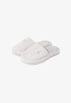 Gray, fluffy slippers with a soft texture, open-toe design, and a subtle logo. The sole is flat and simple, offering comfort and ease of wear.