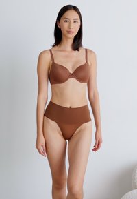 Spanx SPANXSUPERSMOOTH™ UNDIE-TECTABLE® THONG - String - hickory