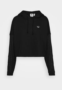 Felpa nera corta in tessuto morbido. Presenta un cappuccio con coulisse, maniche lunghe con dettagli testurizzati e un piccolo logo sul petto.