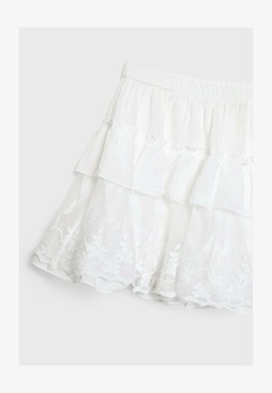 Weißer gestufter Rock aus leichtem Stoff, mit einem Rüschendesign und floraler Spitzenkante am Saum. Elastischer Taillenbund.
