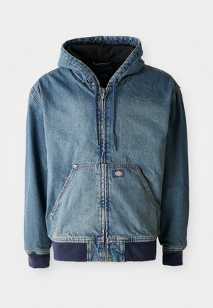 Denim jacket with a hood, featuring a zip front, two large front pockets, and ribbed cuffs. Light blue color with dark navy accents.