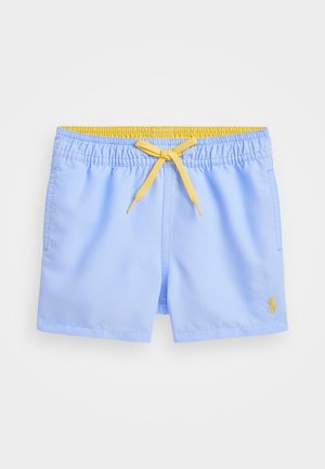Bañador azul claro con cinturilla elástica y cordón amarillo. Tiene un bolsillo lateral y un pequeño logo bordado.
