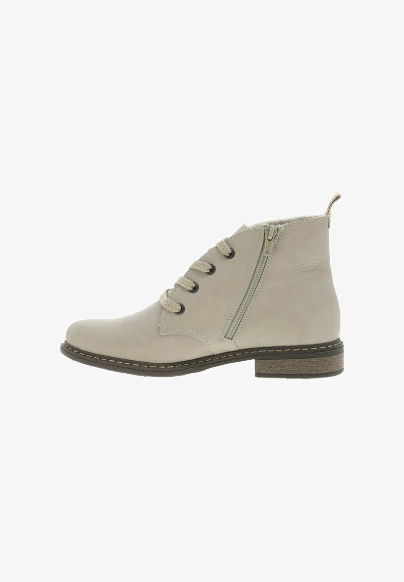 Bottes ankle beiges en cuir avec une texture lisse, dotées d'une fermeture éclair latérale, d'un laçage à l'avant et d'un talon bas.