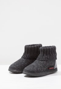 Gray felt boots with a knit cuff, rounded toe, and rubber sole; textured surface with a contrasting red logo on the side.