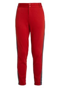 Rode broek van zachte stof, met een aansluitend ontwerp, voorzien van twee knoopsluitingen en zwarte zijstrepen langs elke pijp.