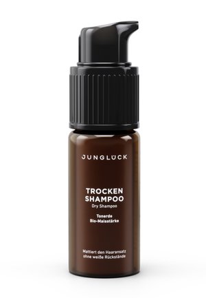 Braune Pumpspender-Flasche mit Junglück Trockenshampoo mit Tonerde und Bio-Maisstärke, etikettiert zur Mattierung der Haarwurzeln ohne weiße Rückstände.