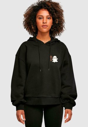 Black oversized hoodie made of soft fabric, featuring a ghost graphic and the text "Boo to You" on the chest. Drawstrings at the hood.