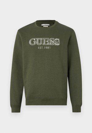 Armeegrüner Sweatshirt mit Rundhalsausschnitt, langen Ärmeln und weißem "GUESS EST. 1981"-Logo. Weicher Stoff und gerippte Bündchen am Saum.