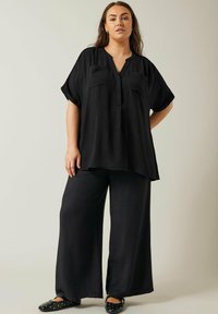 Evans OVERHEAD UTILITY - Tunica - black
