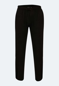 Schwarze Jogginghose mit Kordelzugbund, taillierter Beinform, aus weichem Material, mit schlichter Textur und ohne sichtbare Muster oder Akzente.