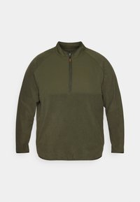 Pullover in pile verde oliva con maniche lunghe, colletto alto e zip frontale a metà con tasche laterali.
