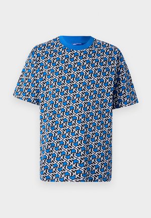 Blue patterned t-shirt featuring interlocking shapes in black and white. Short sleeves and a round neck design. Cotton material.