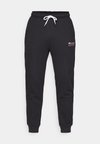 GRAPHIC CUFF PANTS - Tracksuit bottoms - black