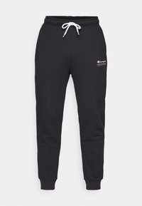 Pelēki, kokvilnas joggeri ar elastīgu jostasvīru, baltu auklu un ribotām piedurknēm. Uz kreisā augšstilba atrodas mazs sarkans un balts logotips.