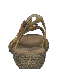 Yellow sandal with a textured cork sole, adjustable straps, and a decorative accent on the front. Open heel design and cushioned footbed.