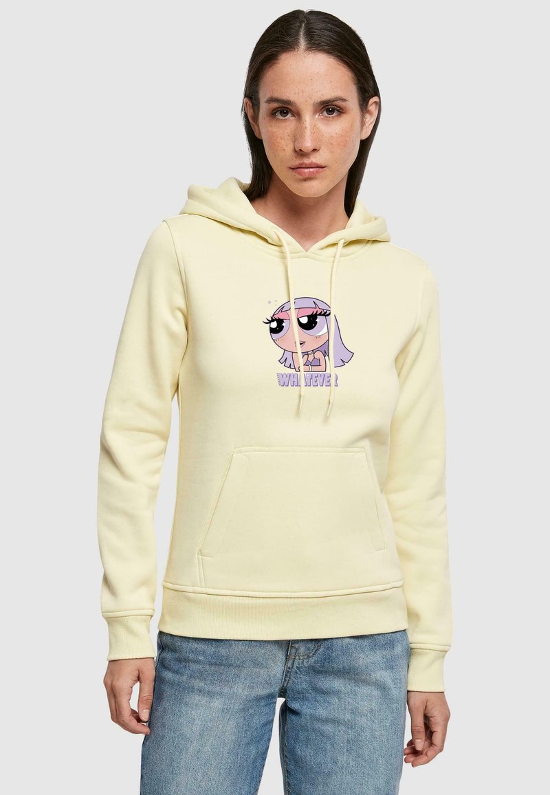 Gul bomullshoodie med snorer, frontlomme, med grafikk av en tegnfigur med store øyne og tekst under.