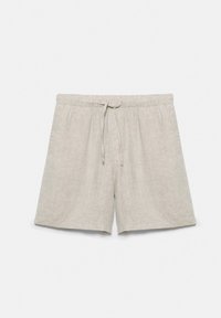 Shorts en lin beige avec cordon de serrage, taille élastique et poches latérales, posés à plat sur fond blanc.