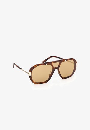 Flieger-Sonnenbrille mit Schildpatt-Muster, braun getönten Gläsern und goldfarbenen Akzenten an den Bügeln vor weißem Hintergrund.