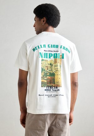 White cotton t-shirt featuring a colorful graphic design of Naples with text. Short sleeves and a relaxed fit, viewed from the back.