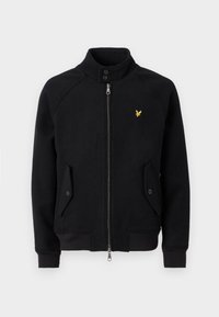Schwarze Zip-Jacke mit hohem Kragen, zwei Fronttaschen, gerippten Bündchen und einem kleinen gelben Logo auf der linken Brust. Weicher Stoff.
