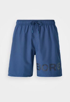 Calções de banho azul marinho, feitos de um tecido leve, com uma cintura elástica com cordão e uma impressão em preto ousada de "BORG" na lateral.