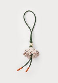 Flower-shaped accessory made of pink leather petals, green cord, and a gold bead. Features two orange tips for added detail.