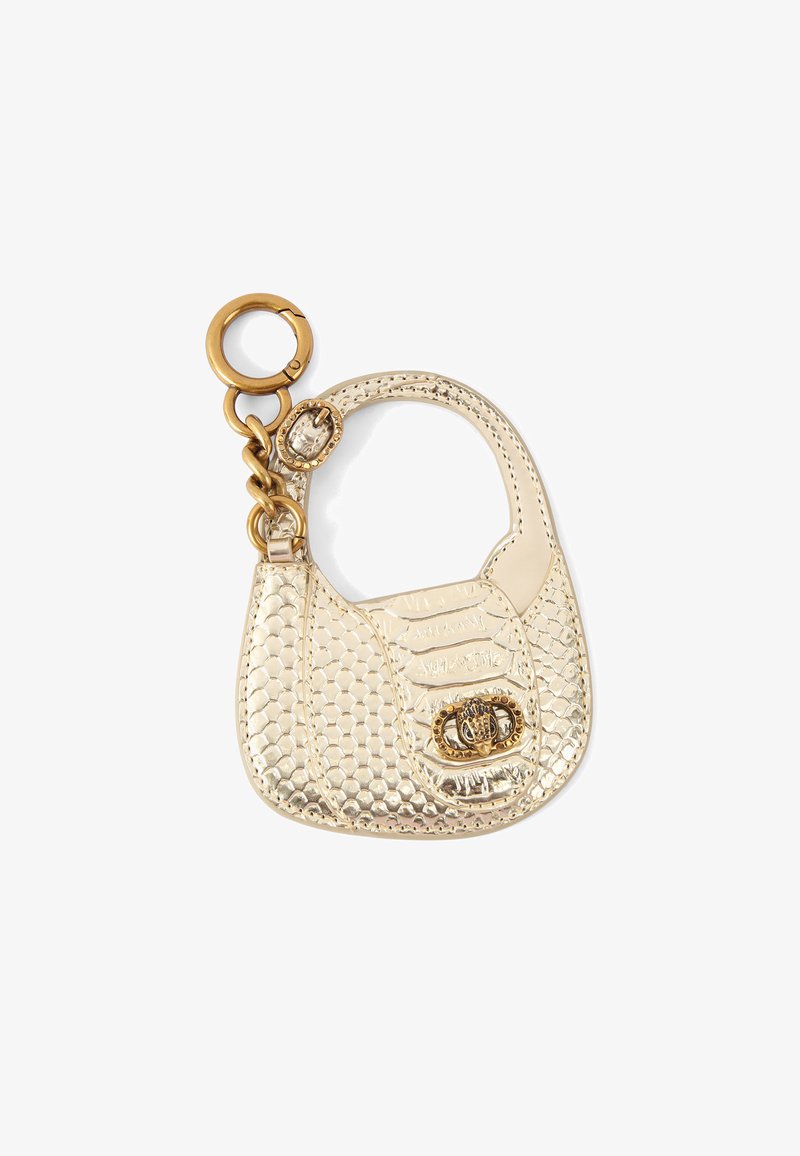 Złoty miniportfel na klucz w stylu torebki z teksturowanym, przypominającym skórę reptila wzorem. Posiada okrągły pierścień i mały zamek z dekoracyjnym akcentem.