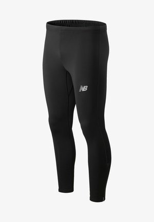 Leggings atletici neri con una texture liscia, vita elasticizzata e un piccolo logo bianco sul lato sinistro. Presentano zip alle caviglie.