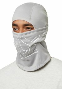 Gray balaclava made of stretchy fabric, featuring a snug fit with a simple design and white logo accents on the front.