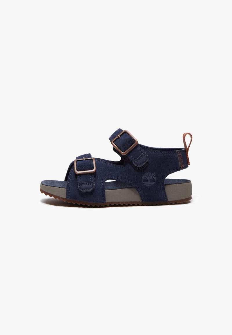 Sandale bleu marine à bout ouvert avec deux brides réglables, languette marron à l'arrière, semelle en caoutchouc nervurée et logo Timberland sur le côté.