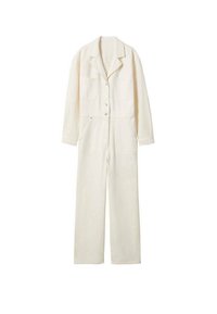 Krémový overal vyrobený z bavlny s límečkem, zapínáním na knoflíky, dvěma předními kapsami a volnými širokými nohavicemi.