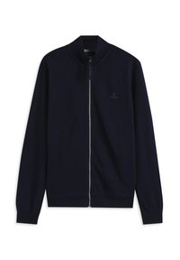 Chaqueta azul marino con cremallera, confeccionada en tela suave. Cuenta con un cuello alto, puños elásticos y un logo minimalista en el pecho.