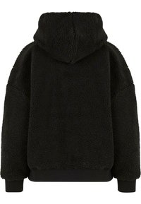 Felpa con cappuccio nera in fleece con superficie testurizzata, cappuccio e polsini e orlo a coste. Presenta una vestibilità ampia e nessuna chiusura visibile.