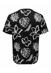 Sort T-shirt med korte ærmer, der har store hvide blomster- og bladmønstre, rund halsudskæring og en afslappet pasform.
