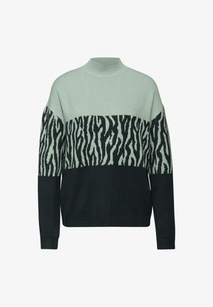 Maglione a maglia verde e nero con collo alto, caratterizzato da un motivo a strisce zebrate lungo il petto. Texture morbida e design ampio.