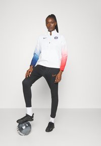Nike Performance ACADEMY PANTS - Spodnji deli trenirk - black/bright crimson
