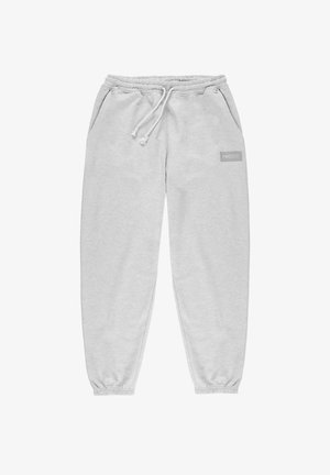 Jasnoszare dresy z elastycznym pasem, sznurkiem, bocznymi kieszeniami i małym logo "PROSTO" na lewej udzie. Miękka tekstura.