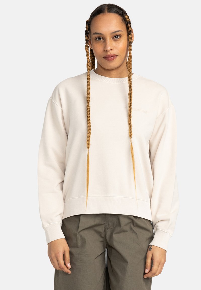 Felpa color beige chiaro con scollo rotondo, polsini a coste e vestibilità rilassata. Il tessuto appare morbido con dettagli di cucitura minimi.