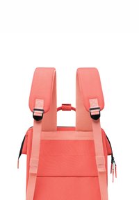 Coral backpack with padded straps, adjustable clips, and a textured exterior. Features a top handle and zippers for secure closure.