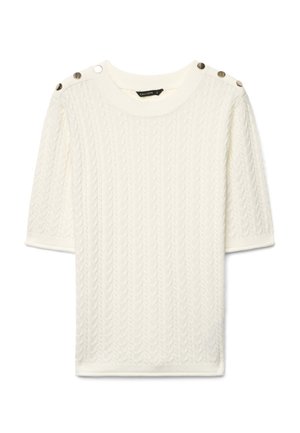 Maglia bianca a maniche corte con lavorazione a treccia, scollo rotondo e bottoni decorativi in metallo sulle cuciture delle spalle.