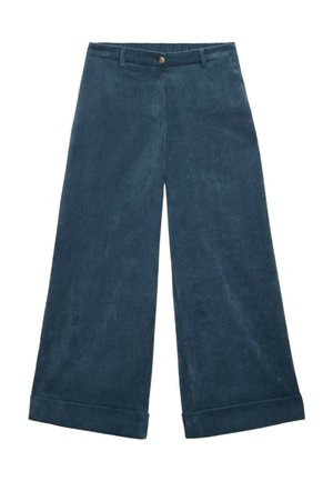Pantalones de pana de pierna ancha en azul oscuro. El material tiene una textura acanalada. El diseño presenta un cierre con botón y puños doblados.