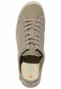 Beige canvas sneaker with textured upper, visible stitching, cream rubber sole, and frayed accents around the collar. Green patterned insole.