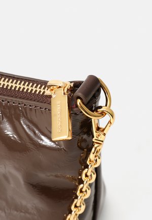 Brown patent leather bag with a gold zipper and chain strap, featuring a branded tag and smooth, glossy texture.
