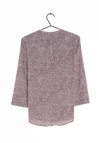 Langärmlige Bluse in dunklem Mahagoni mit einem weißen abstrakten Muster. Sie hat einen runden Ausschnitt, einen leichten Stoff und eine entspannte Passform.