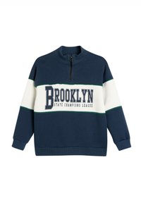 Sudadera azul marino con rayas blancas y verdes. Cuenta con un cuello con media cremallera y "BROOKLYN STATE CHAMPIONS LEAGUE" impreso de forma destacada. Mezcla de algodón.
