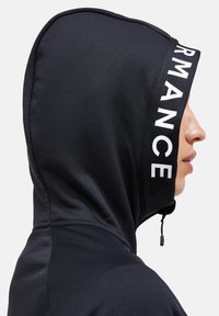 Black hooded sweatshirt featuring a smooth texture, drawstring, and a white "PERFORMANCE" logo along the edge of the hood.