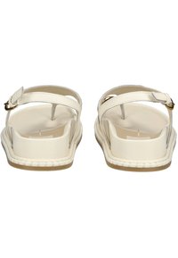 Sandali in pelle bianca presentano un design semplice con due cinturini regolabili, una suola piatta e dettagli cuciti attorno ai bordi.