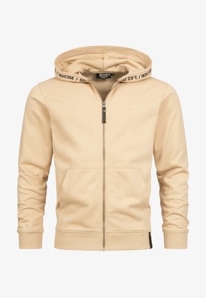 Sweatshirt zippé beige en tissu doux avec une capuche à cordon, des poignets côtelés et un accent de logo sur la poitrine et la capuche, avec des poches latérales.
