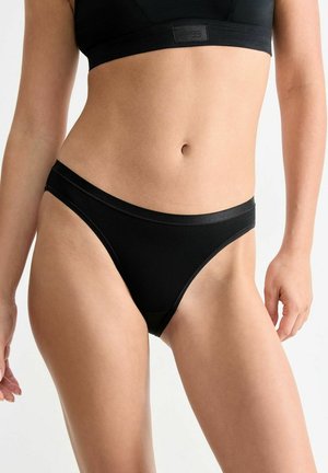 Black thong underwear features a smooth fabric, minimal coverage, and a thin waistband. The design is simple and seamless.
