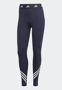 Leggings sportivi blu marina con una fascia alta in vita e accenti del logo bianchi, design aderente e tre strisce bianche lungo la parte inferiore delle gambe.